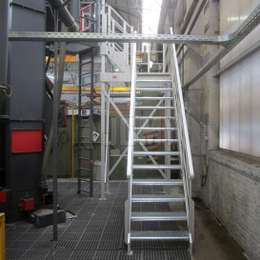 Aluminium stairs for machinery access Aluminium stairs for machine access and maintenance in a factory.